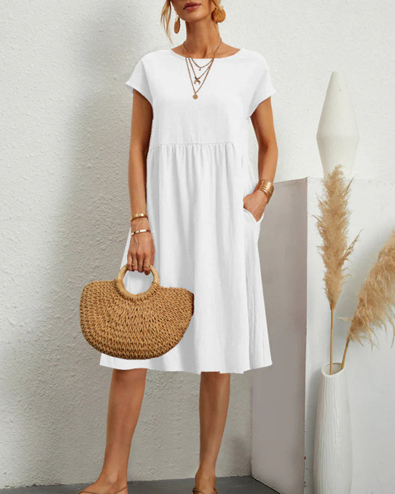 Comfortable midi dress with a round neckline and pockets