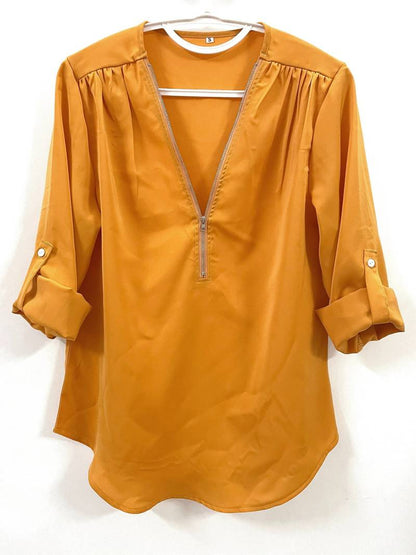 Hazel – casual, ruffled blouse with roll-up sleeves and half zip