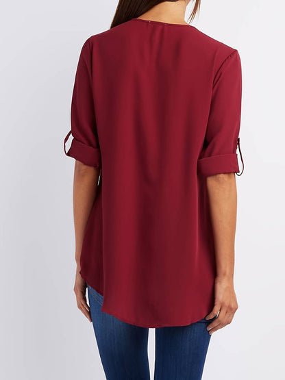 Hazel – casual, ruffled blouse with roll-up sleeves and half zip