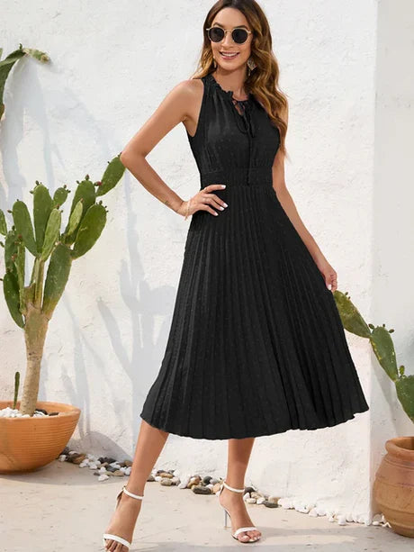 Carla – black pleated dress with halterneck